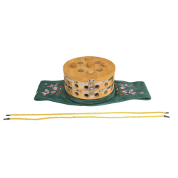 Okrągłe pudełko do moksoterapii w haftowanym pokrowcu